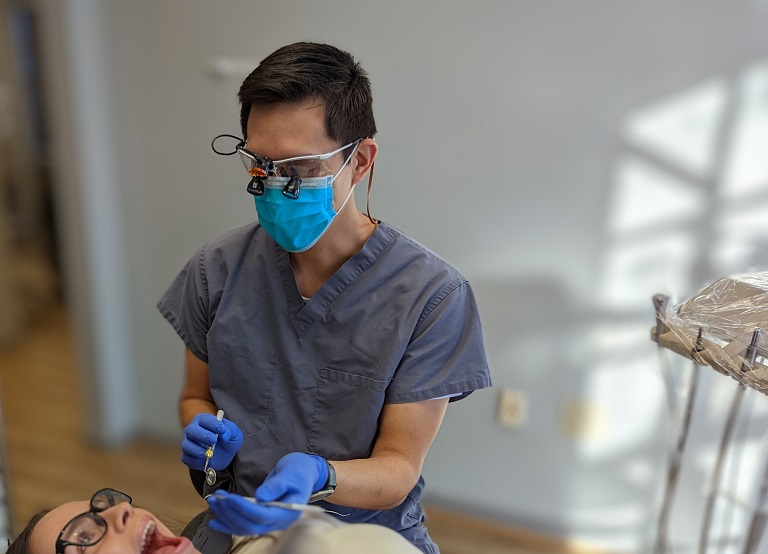 Dentist about to clean woman's teeth