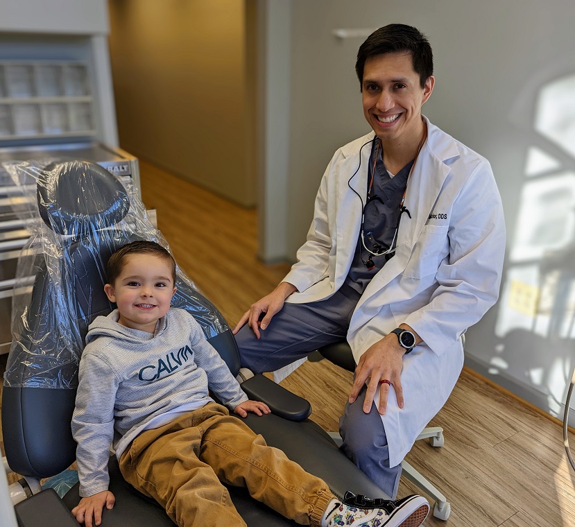 Child in a dental chair with the dentist