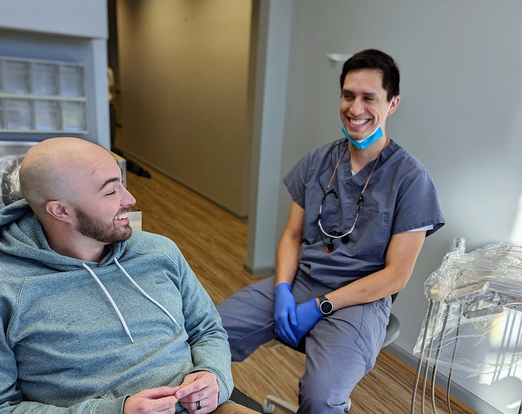 Dentist and client in dental office
